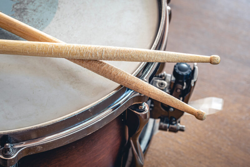 Close-up, drumsticks on a blurred background.