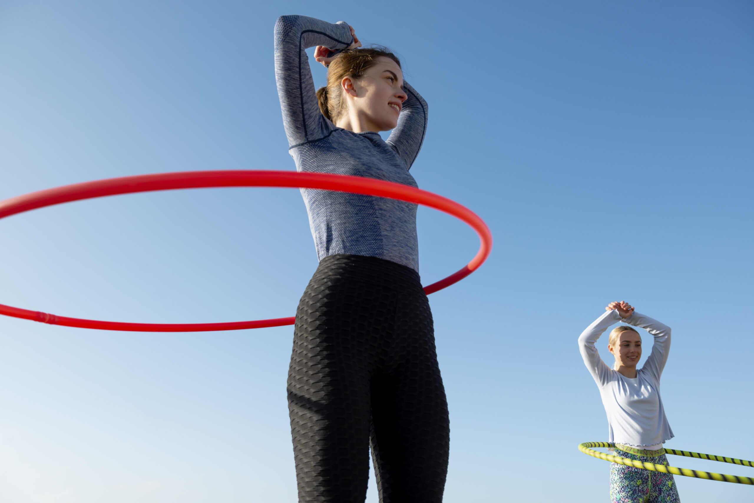 women-exercising-with-hula-hoop-circle